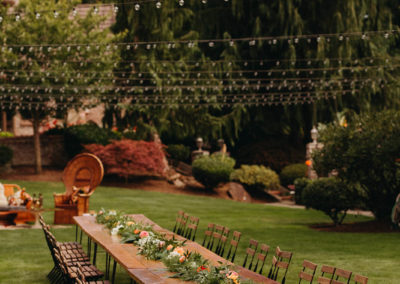 Row_of_farmhouse_tables_set_at_wedding_near_seattle