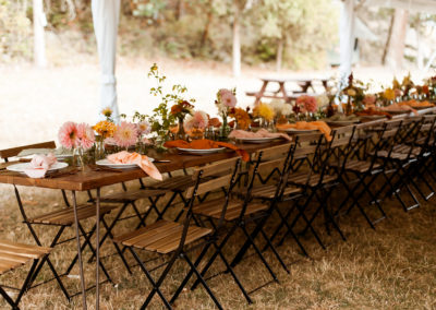 Row_of_farm_tables_from_Wander_Event_Rentals_at_Pebble_Cove_farm
